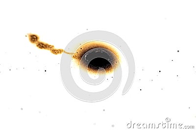 Burned hole on paper, isolate on white background Stock Photo