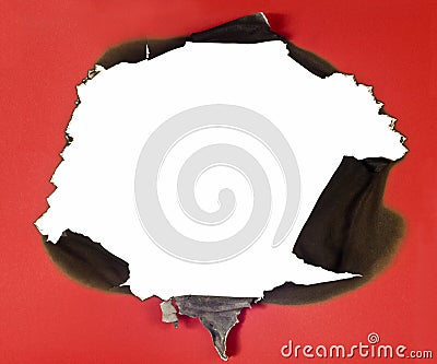 Burned Hole In Red Paper Stock Photo