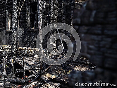 Burned house to the ground. Lots of black coal after the fire Stock Photo