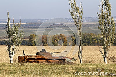 Burned infantry fighting vehicle in the trees Stock Photo