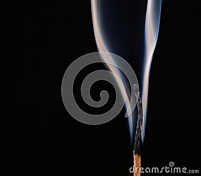 Burned match with clouds of smoke on a black Stock Photo