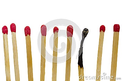 Burned match next to new matches Stock Photo