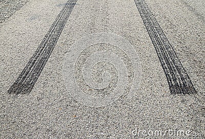 Burned rubber tire track on an asphalt road Stock Photo