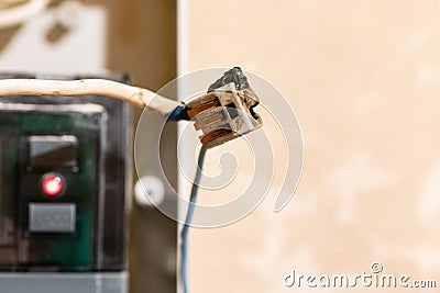 Burned wire, splicing connector, electrical terminal block of nonflammable, fireproof material. Faulty wiring or negligent Stock Photo