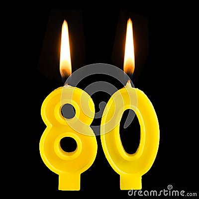 Burning birthday candles in the form of 80 eighty figures for cake isolated on black background. The concept of celebrating a birt Stock Photo
