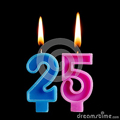Burning birthday candles in the form of 25 twenty five figures for cake on black background. The concept of celebrating a Stock Photo