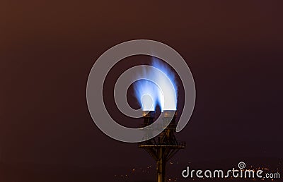 Burning blue fire flame on a pipe factory Stock Photo