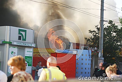 Burning building in the city. Fire extinguishing operation Editorial Stock Photo