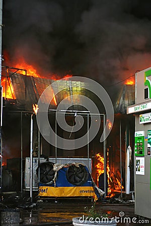 Burning building in the city. Fire extinguishing operation Editorial Stock Photo