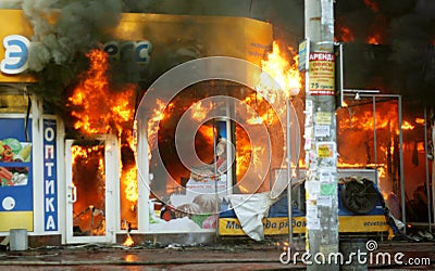 Burning building in the city. Fire extinguishing operation Editorial Stock Photo