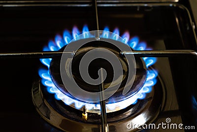 Burning burner, blue fire gas, gas stove with burning propane, economy concept Stock Photo