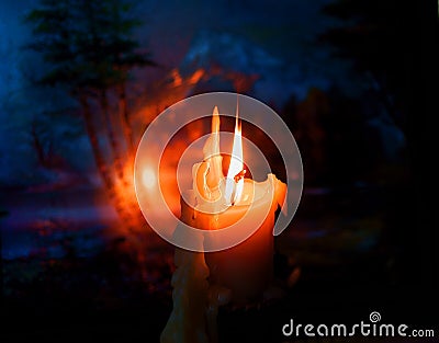 The flame of a burning candle Stock Photo