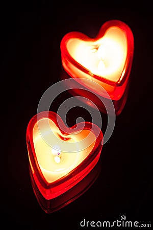 Burning candle hearts Stock Photo