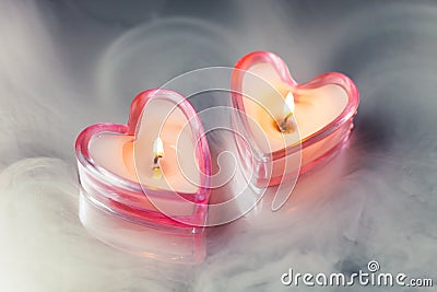 Burning candle hearts Stock Photo