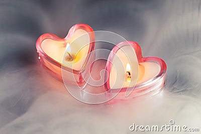 Burning candle hearts Stock Photo