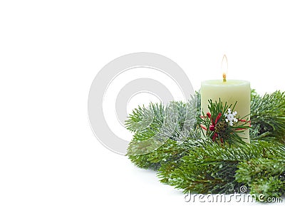 Christmas burning candle, snowy pine branches on a white background. Christmas or Winter holiday concept. Isolated Stock Photo