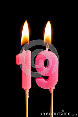 Burning candles in the form of 189 nineteen figures numbers, dates for cake isolated on black background. The concept of celebra Stock Photo