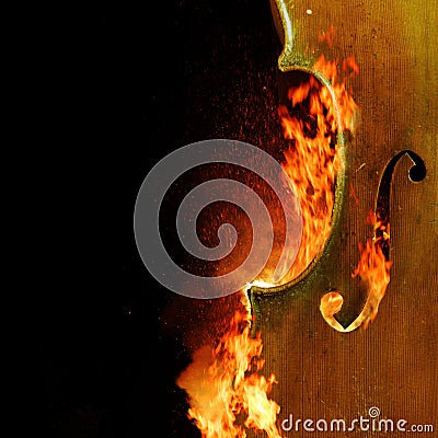 Burning chello, dark atmospheric mood, music instrument fantasy background Stock Photo