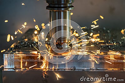 The burning chip from CNC milling machine rough cutting by index-able end-mill tools. Stock Photo