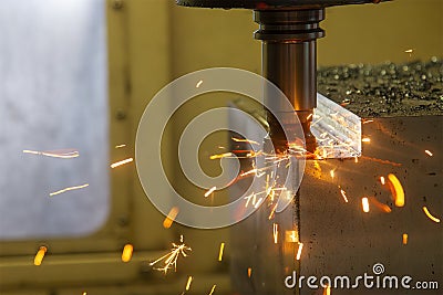 The burning chip from wear cutting tools on CNC milling machine Stock Photo
