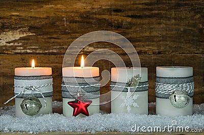 Christmas candles decorated with ornaments for Advent Season Stock Photo