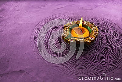 Burning diya on Happy Diwali, background for light festival of India Stock Photo
