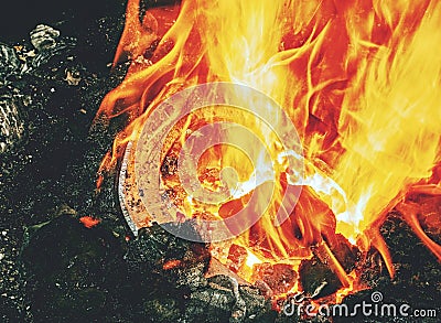 Burning fire in the blacksmith coal forge. Red hot forging metal Stock Photo