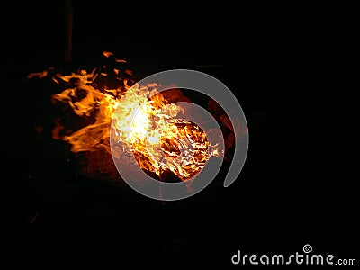 Burning fire in the night symbolizes purification. Stock Photo