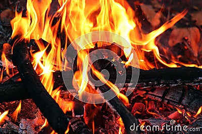 Burning firewood, spurts of flame Stock Photo