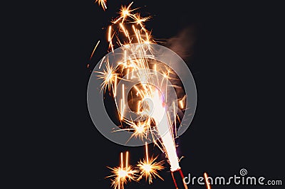 Burning flare or flame with bright sparks and smoke from a burnt candle on background with copy space. festive event concept Stock Photo