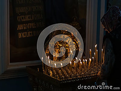 Burning funeral candles in orthodox church Stock Photo