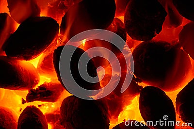 Burning glowing coal fire - close-up background Stock Photo