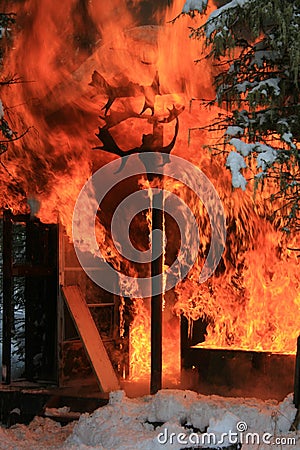 Burning hunting cabin Stock Photo