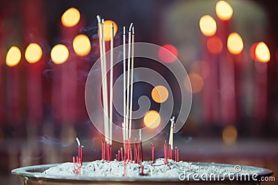 Burning incense in Chinese temple Stock Photo