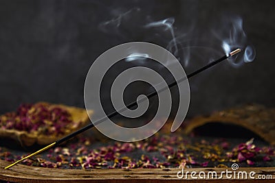 Burning incense on a wooden stand. Editorial Stock Photo