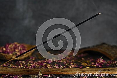 Burning incense on a wooden stand. Editorial Stock Photo