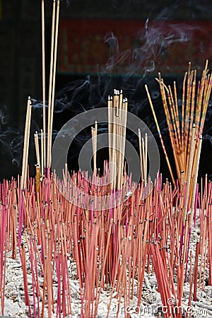 Burning incense and worship the gods in the buddhist temple in Qingyan Ancient Town, Guizhou province, China. The old town is. Stock Photo