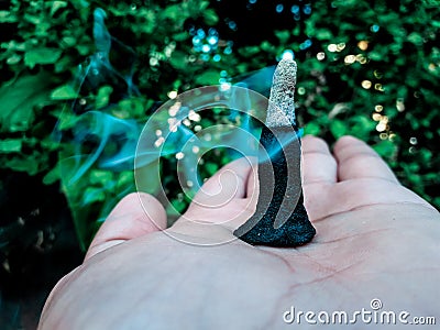 , burning insence cone with smoke Stock Photo