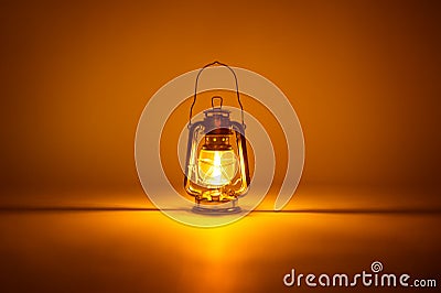 Burning kerosene lamp background Stock Photo