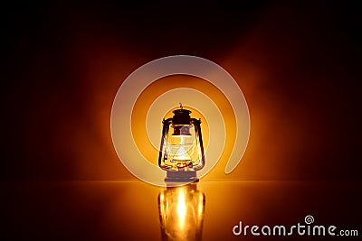 Burning kerosene lamp background Stock Photo