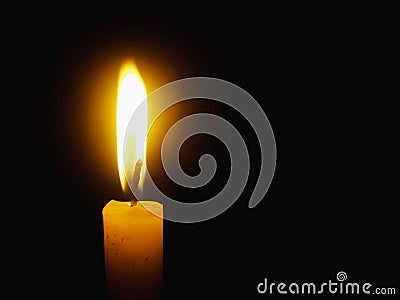 Burning light Candle flame close up on a black background Stock Photo