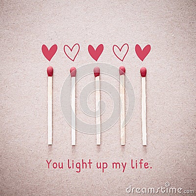 Burning love match with heart shape fire light with wording You light up my life valentine card Stock Photo