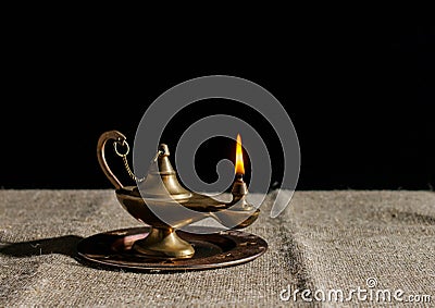 Burning magic lamp of aladdin Stock Photo