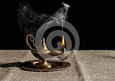 Burning magic lamp of aladdin Stock Photo