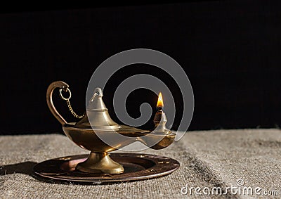 Burning magic lamp of aladdin Stock Photo