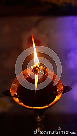 A Burning Oil Lamp in a Namghar in the Indian State of Assam Stock Photo