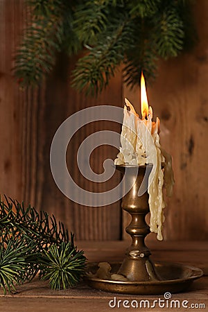 Burning old Candle Vintage Bronze candlestick on Stock Photo