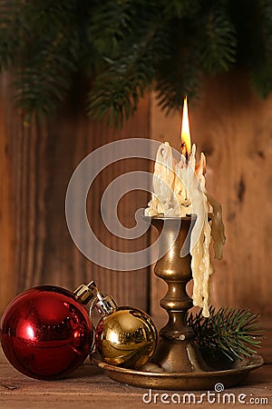 Burning old Candle Vintage Bronze candlestick on Stock Photo