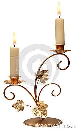 Burning old candle vintage golden candlestick. Stock Photo