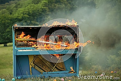 Burning piano. Grunge instrument, burning piano, musical style. Stock Photo